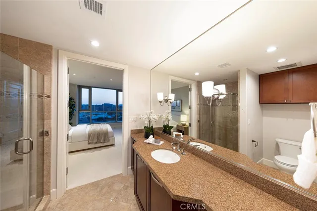 a view of a walk in closet with empty racks