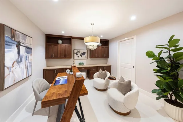 a dining room with furniture and a chandelier