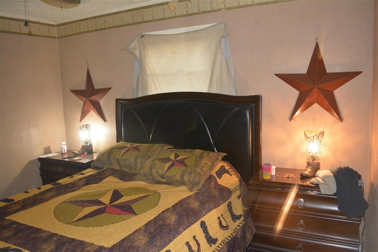 1292 Sweet Lips Road Finger, TN 38334 - Photo 11 of 15 a bedroom with a bed and window