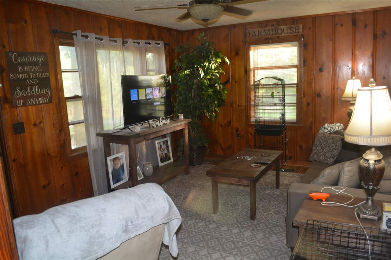 1292 Sweet Lips Road Finger, TN 38334 - Photo 9 of 15 a living room with furniture and a flat screen tv