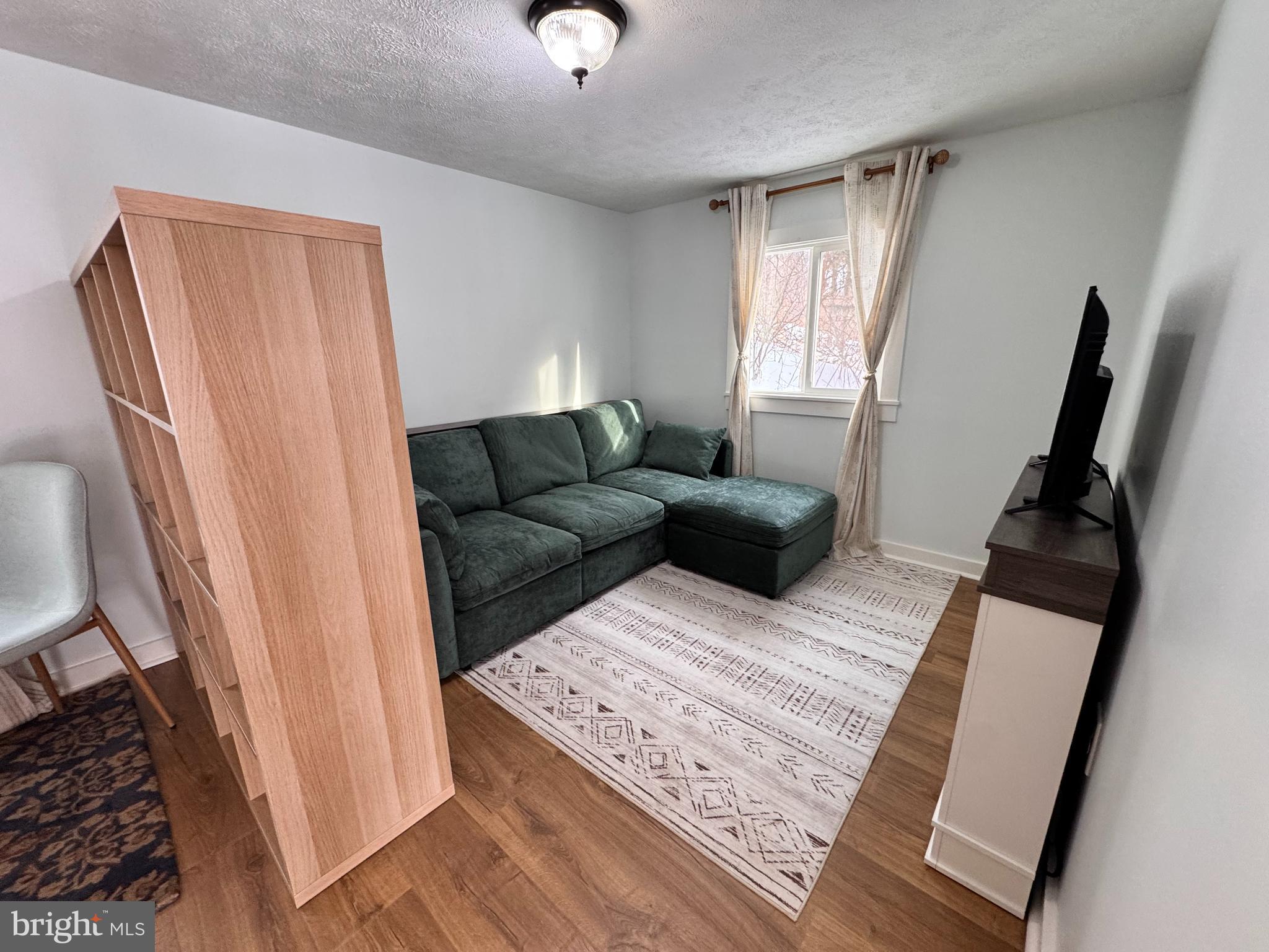 14 Summit Point Drive Front Royal, VA 22630 - Photo 12 of 32 a living room with furniture and a window