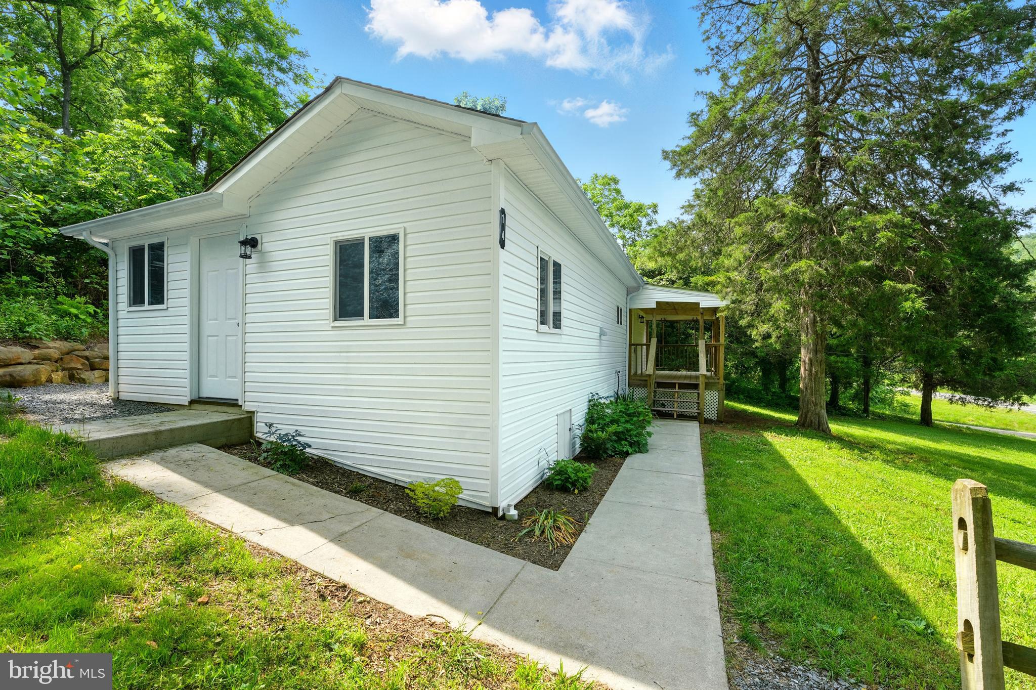 14 Summit Point Drive Front Royal, VA 22630 - Photo 6 of 32 a view of a house with yard and a garden
