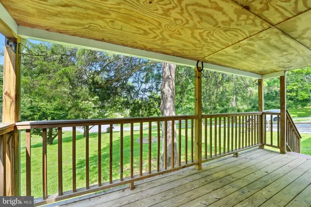 a view of balcony with wooden floor