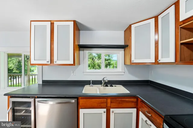a kitchen that has a sink and a window