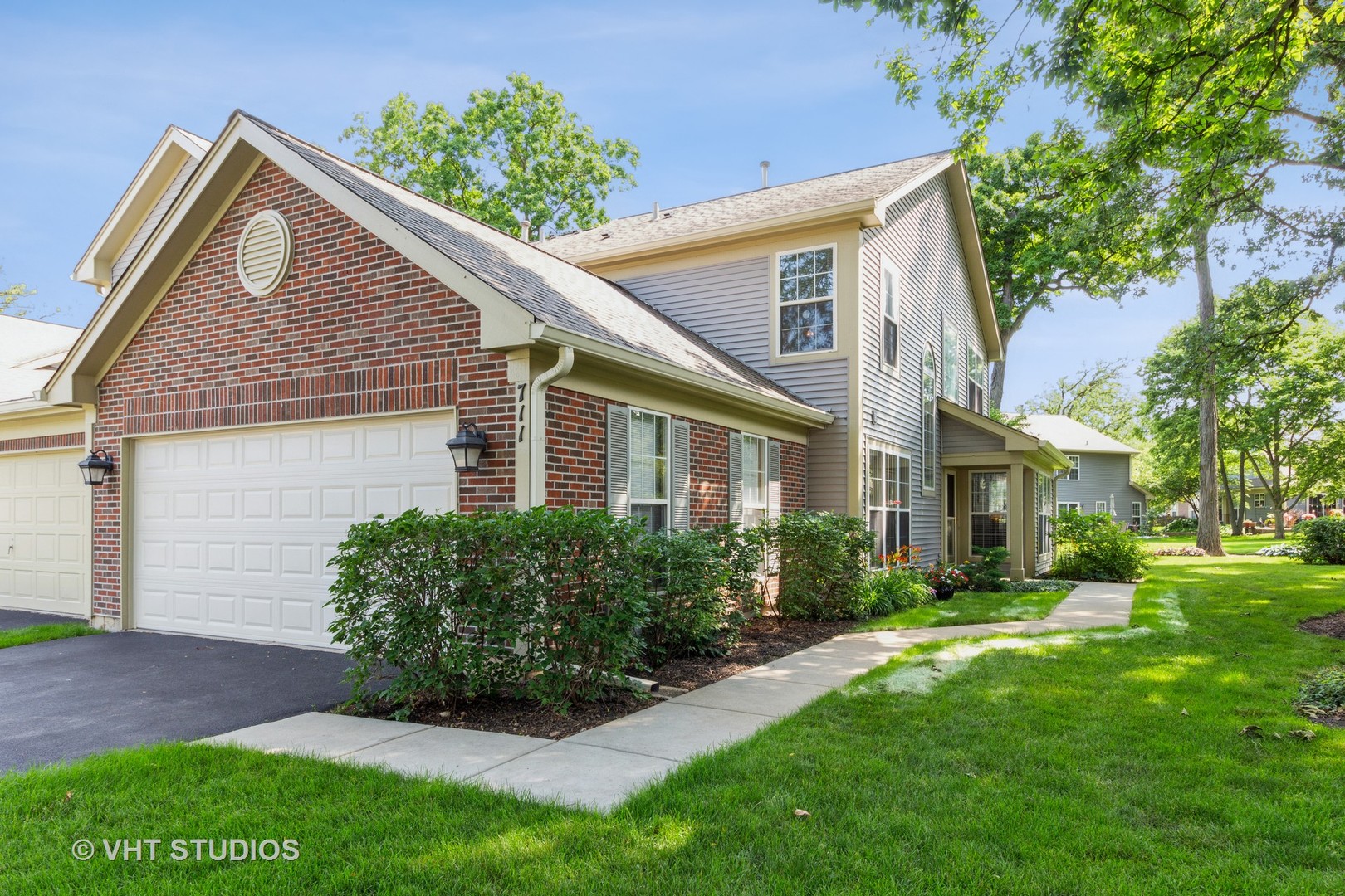 711 Bent Ridge Lane Elgin, IL 60120 - Photo 1 of 26 a front view of a house with a yard