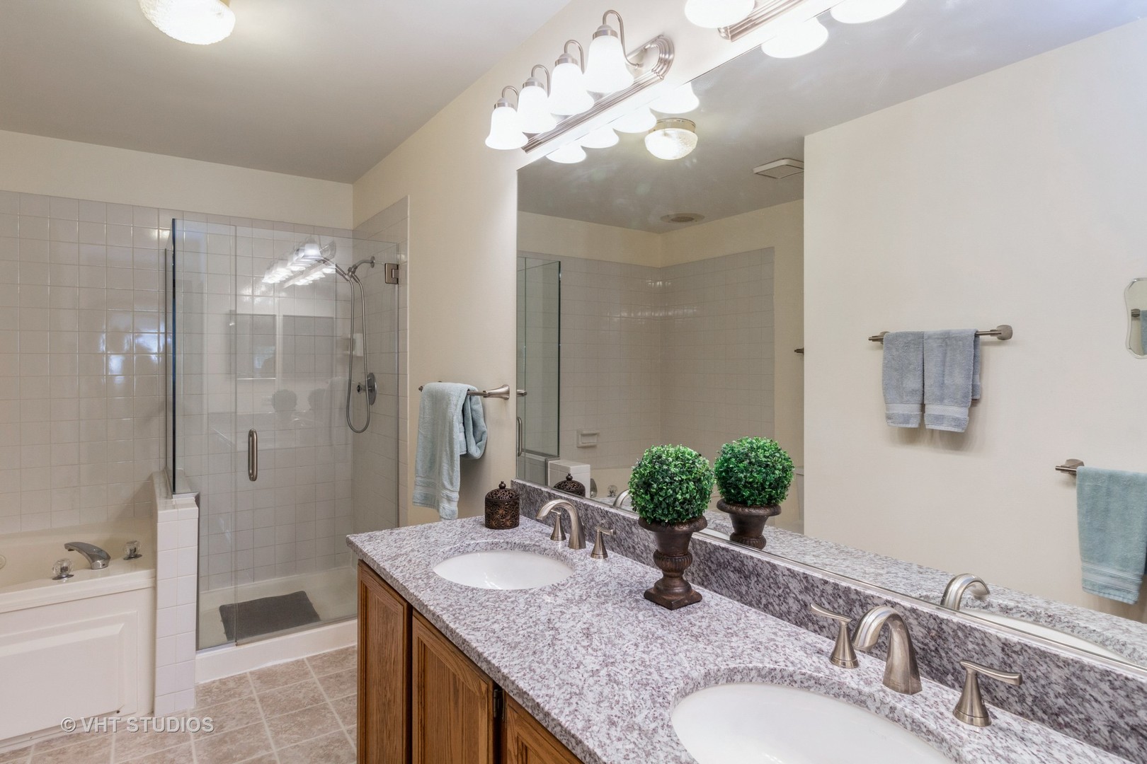 711 Bent Ridge Lane Elgin, IL 60120 - Photo 16 of 26 a bathroom with a granite countertop sink a mirror and a shower