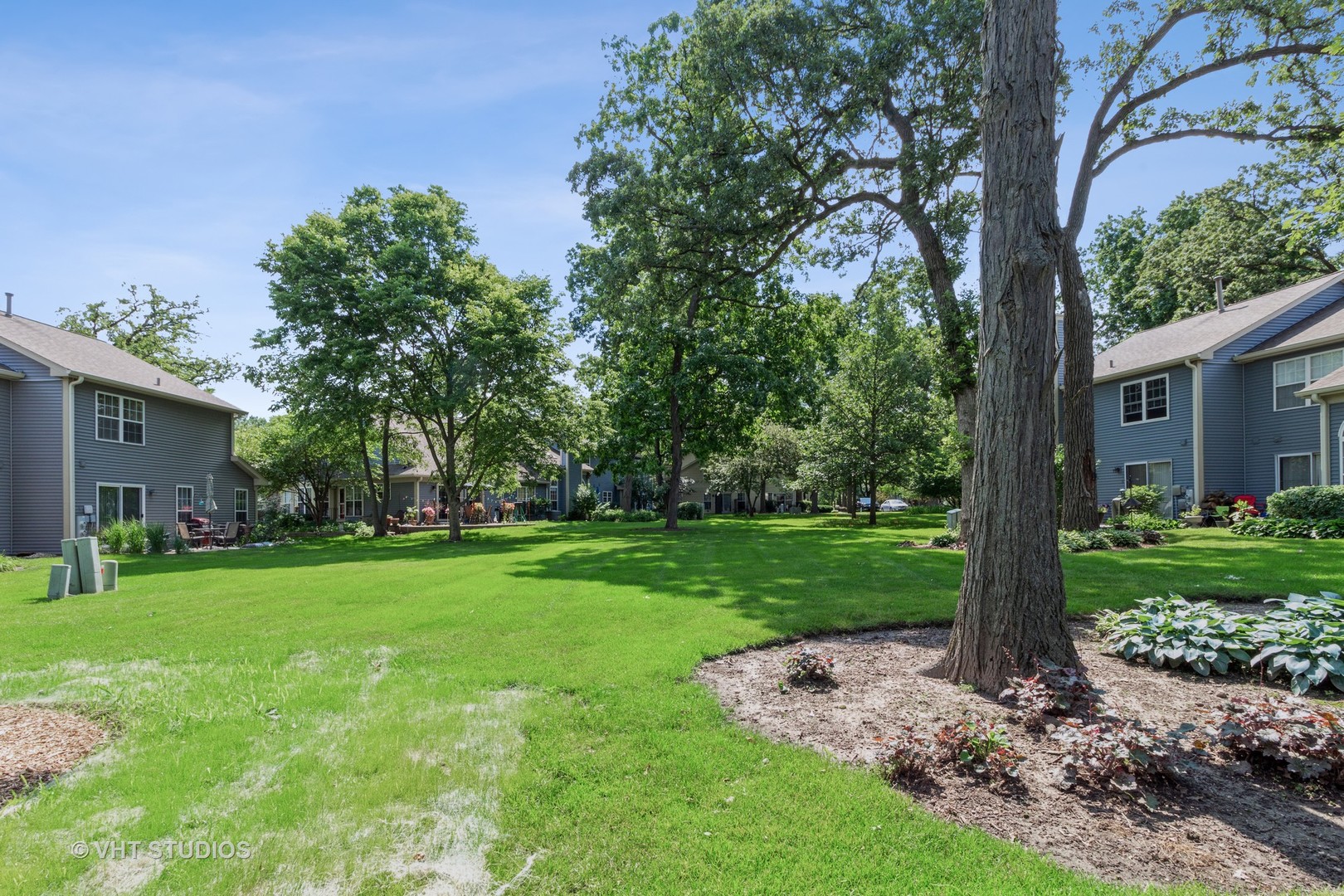 711 Bent Ridge Lane Elgin, IL 60120 - Photo 22 of 26 a view of a house with a backyard