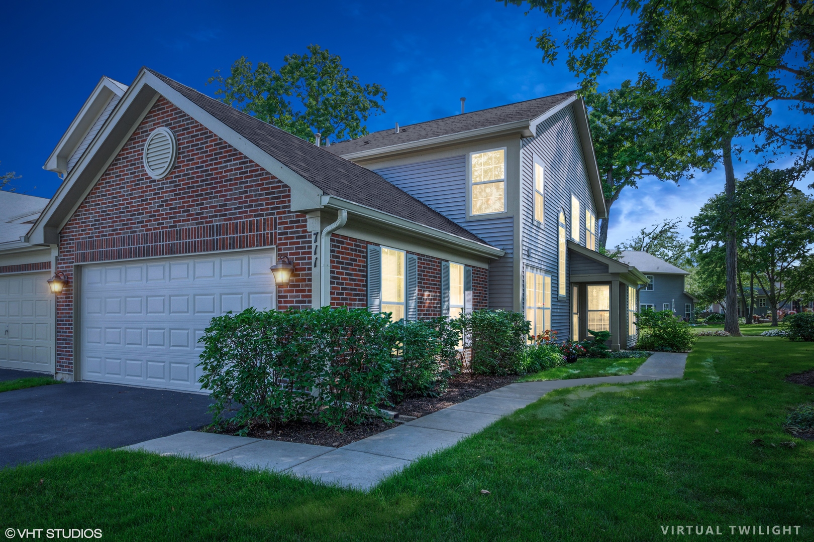711 Bent Ridge Lane Elgin, IL 60120 - Photo 23 of 26 a front view of a house with a yard