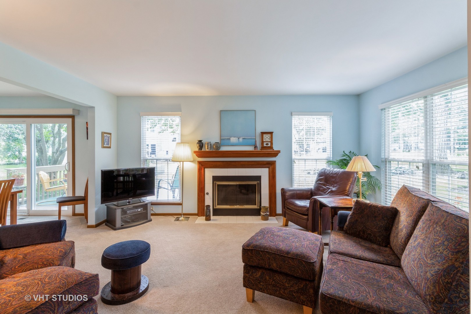 711 Bent Ridge Lane Elgin, IL 60120 - Photo 4 of 26 a living room with furniture a flat screen tv and a fireplace