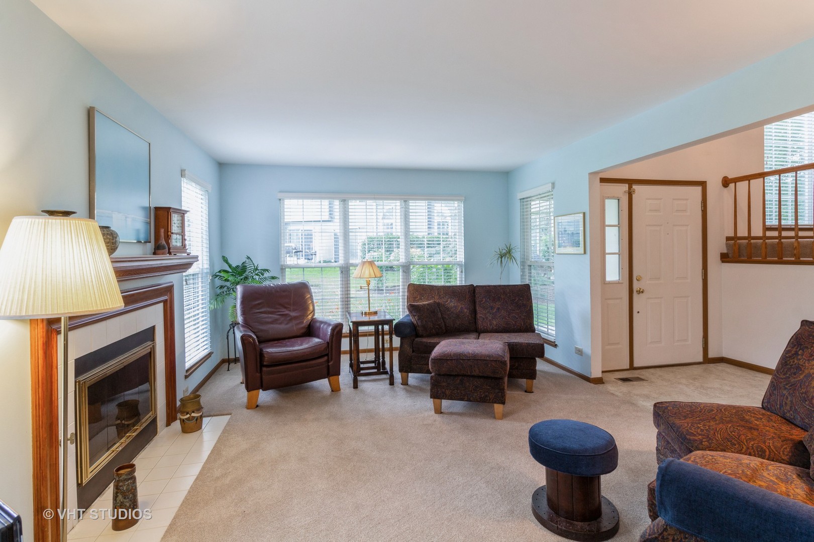711 Bent Ridge Lane Elgin, IL 60120 - Photo 5 of 26 a living room with furniture a fireplace and a window