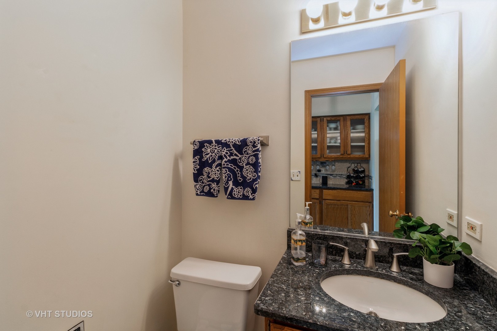 711 Bent Ridge Lane Elgin, IL 60120 - Photo 7 of 26 a bathroom with a toilet a sink and mirror