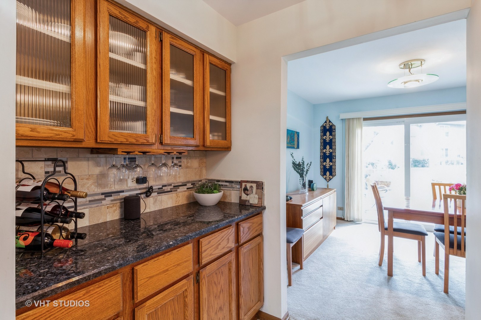 711 Bent Ridge Lane Elgin, IL 60120 - Photo 8 of 26 a kitchen with granite countertop a stove a sink and a dining table
