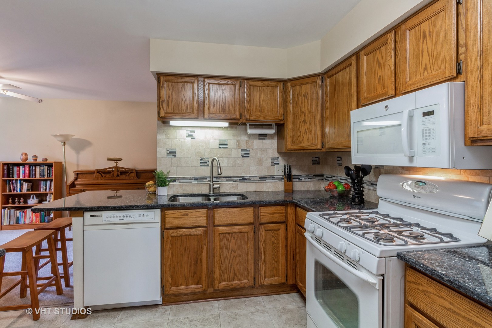 711 Bent Ridge Lane Elgin, IL 60120 - Photo 9 of 26 a kitchen with a stove top oven sink and cabinets