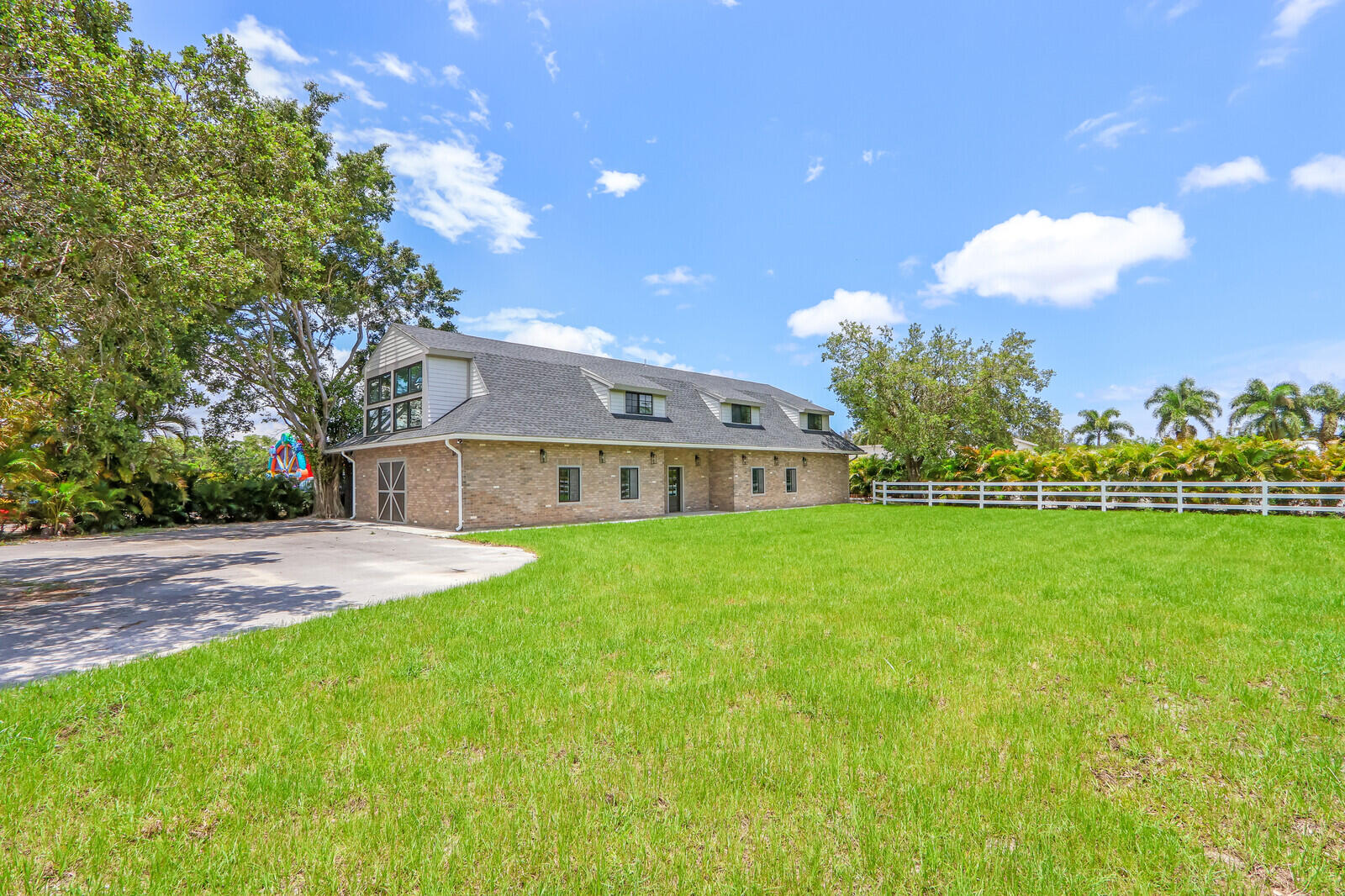 17120 Jupiter Farms Road, Unit C Jupiter, FL 33478 - Photo 2 of 52 FRONT LAWN