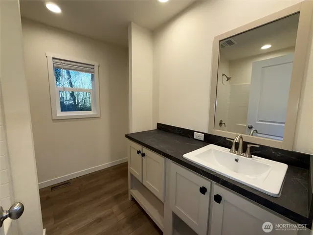 a bathroom with a toilet and a bathtub