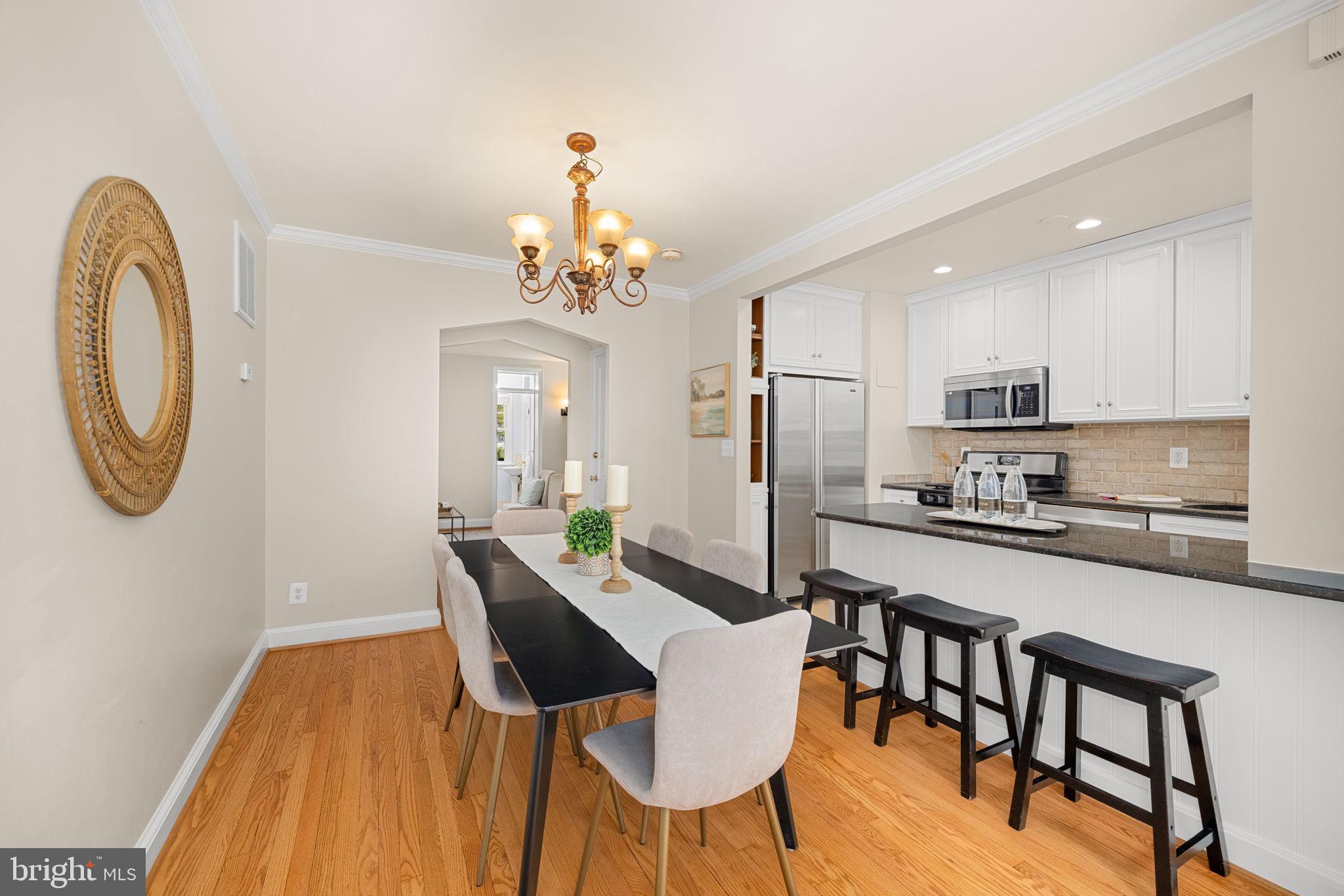 3762 W Street Northwest Washington, DC 20007 - Photo 11 of 41 a view of a dining room with furniture and wooden floor