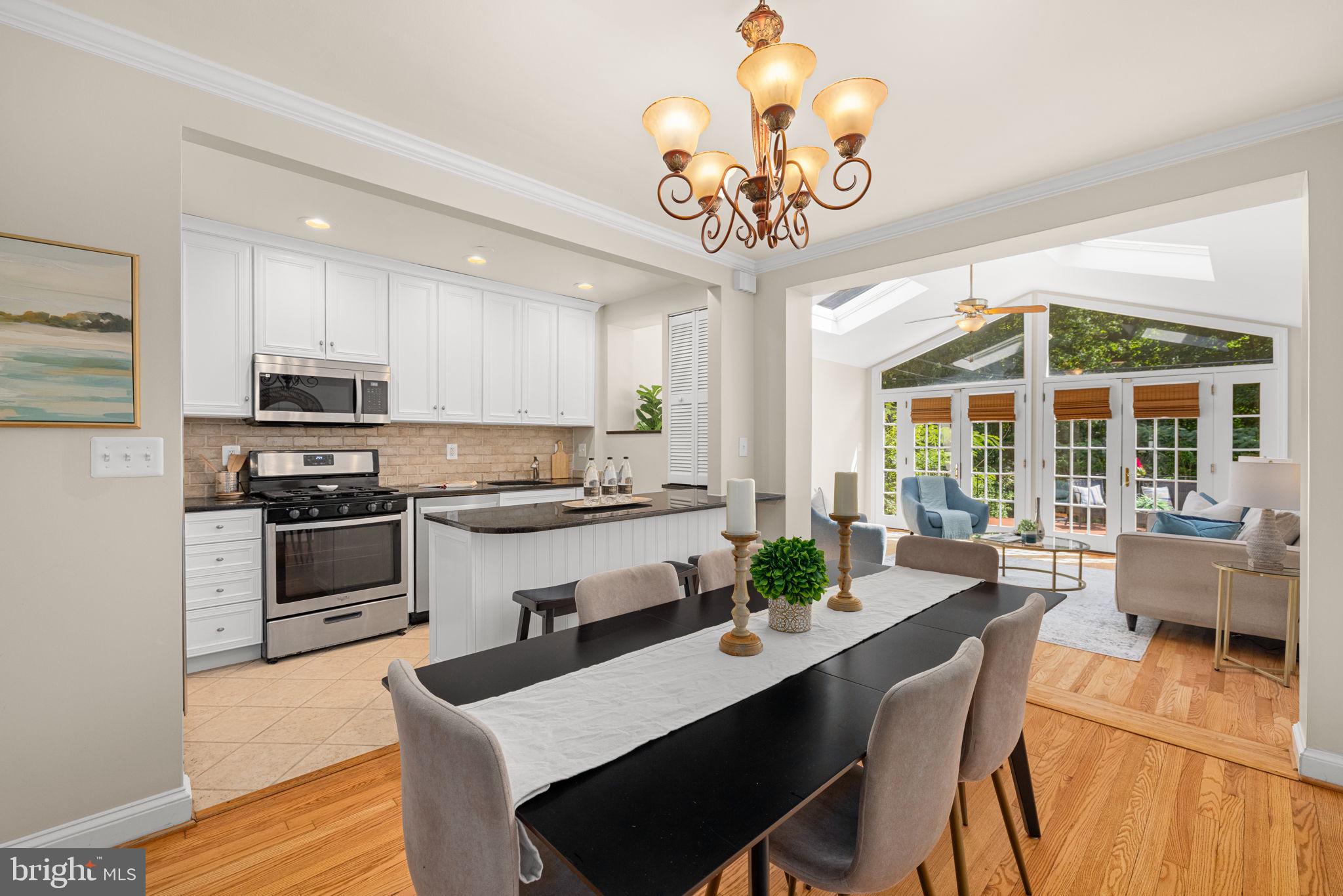 3762 W Street Northwest Washington, DC 20007 - Photo 41 of 41 a view of a dining room with furniture a chandelier and wooden floor