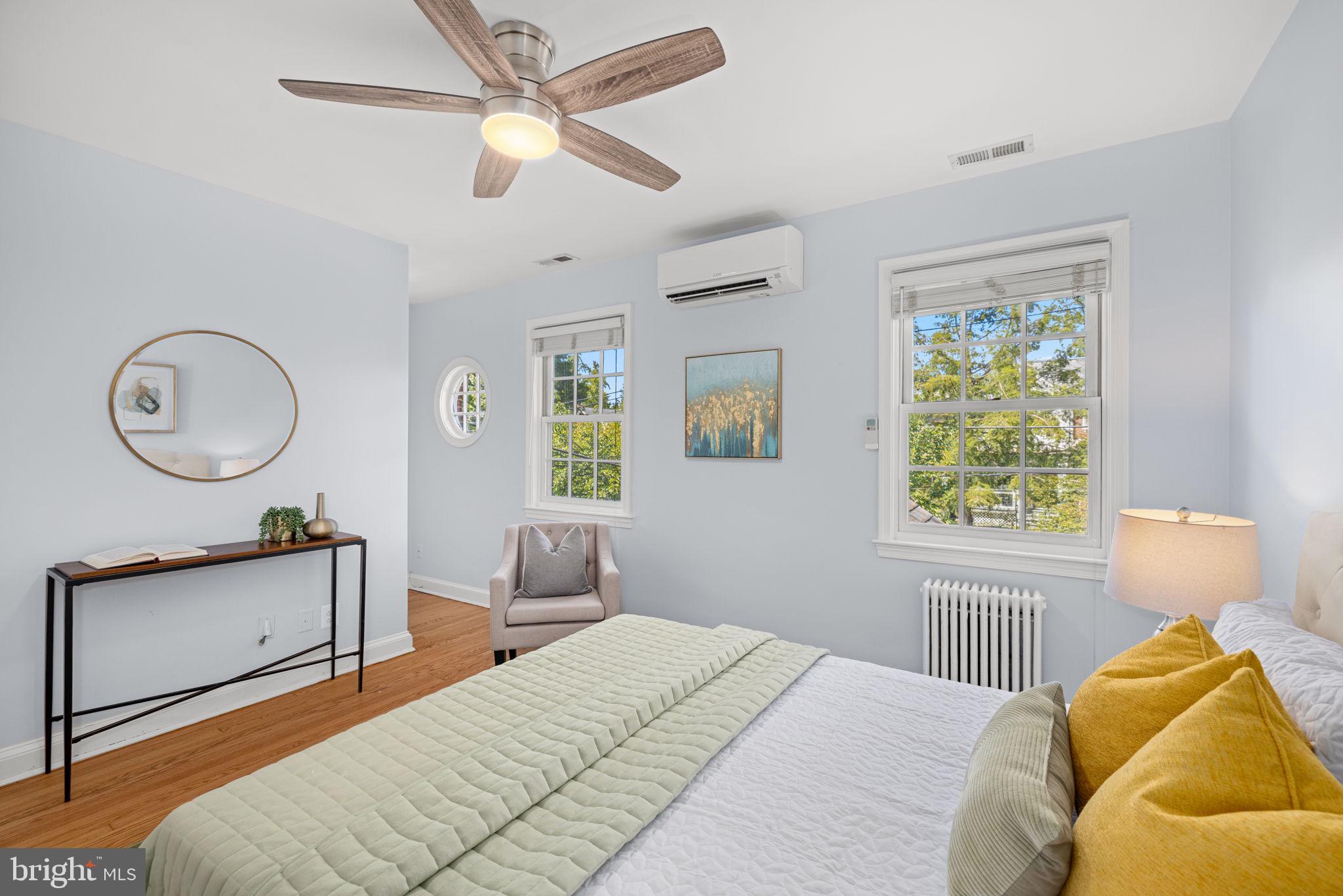 3762 W Street Northwest Washington, DC 20007 - Photo 22 of 41 a bedroom with a bed a window and a chandelier