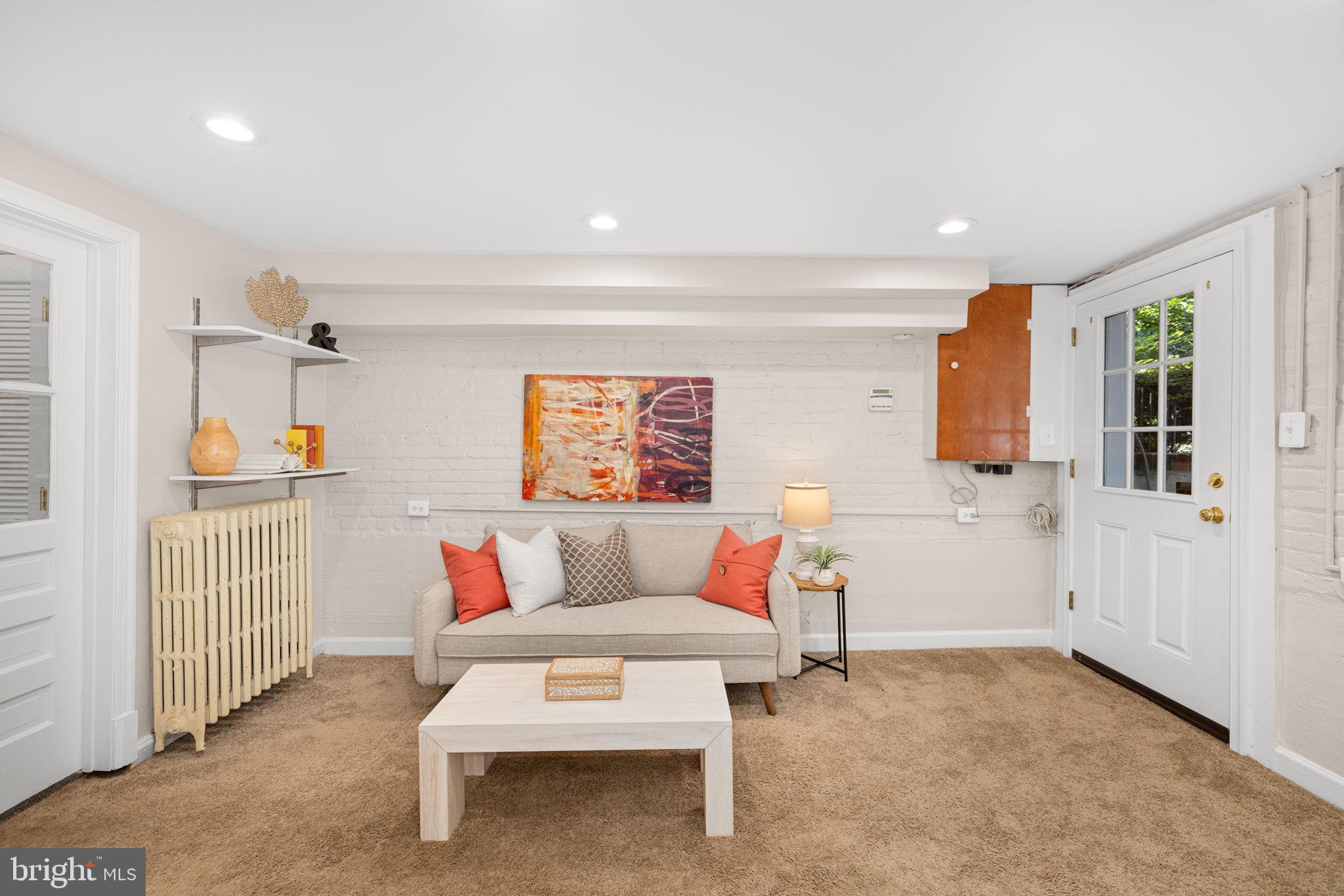 3762 W Street Northwest Washington, DC 20007 - Photo 31 of 41 a living room with furniture and a window