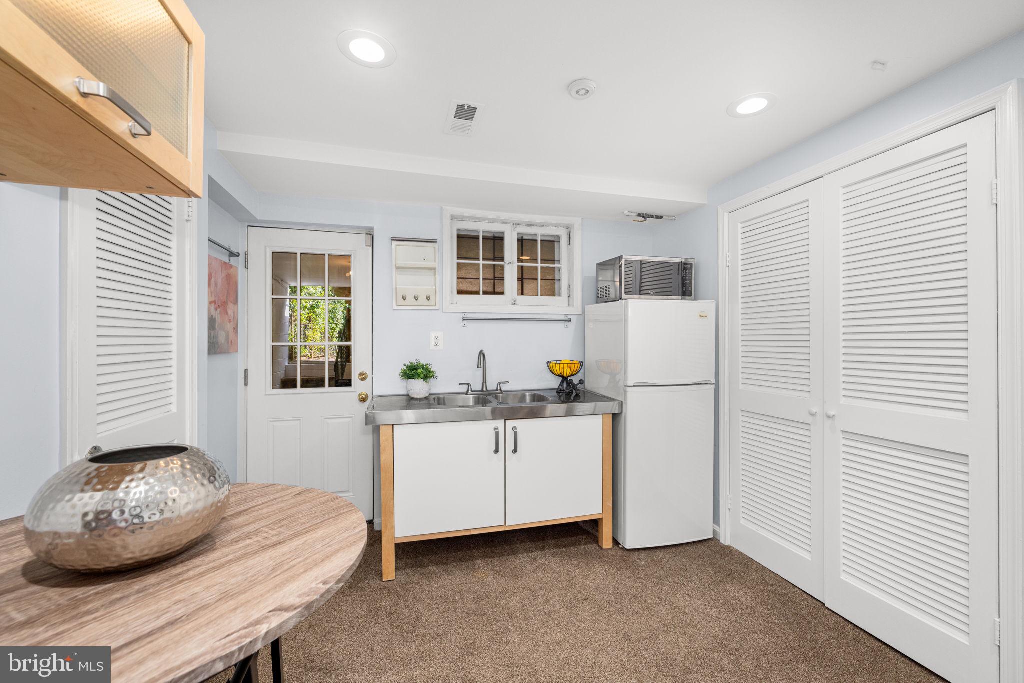 3762 W Street Northwest Washington, DC 20007 - Photo 33 of 41 a kitchen with stainless steel appliances granite countertop a sink and a stove