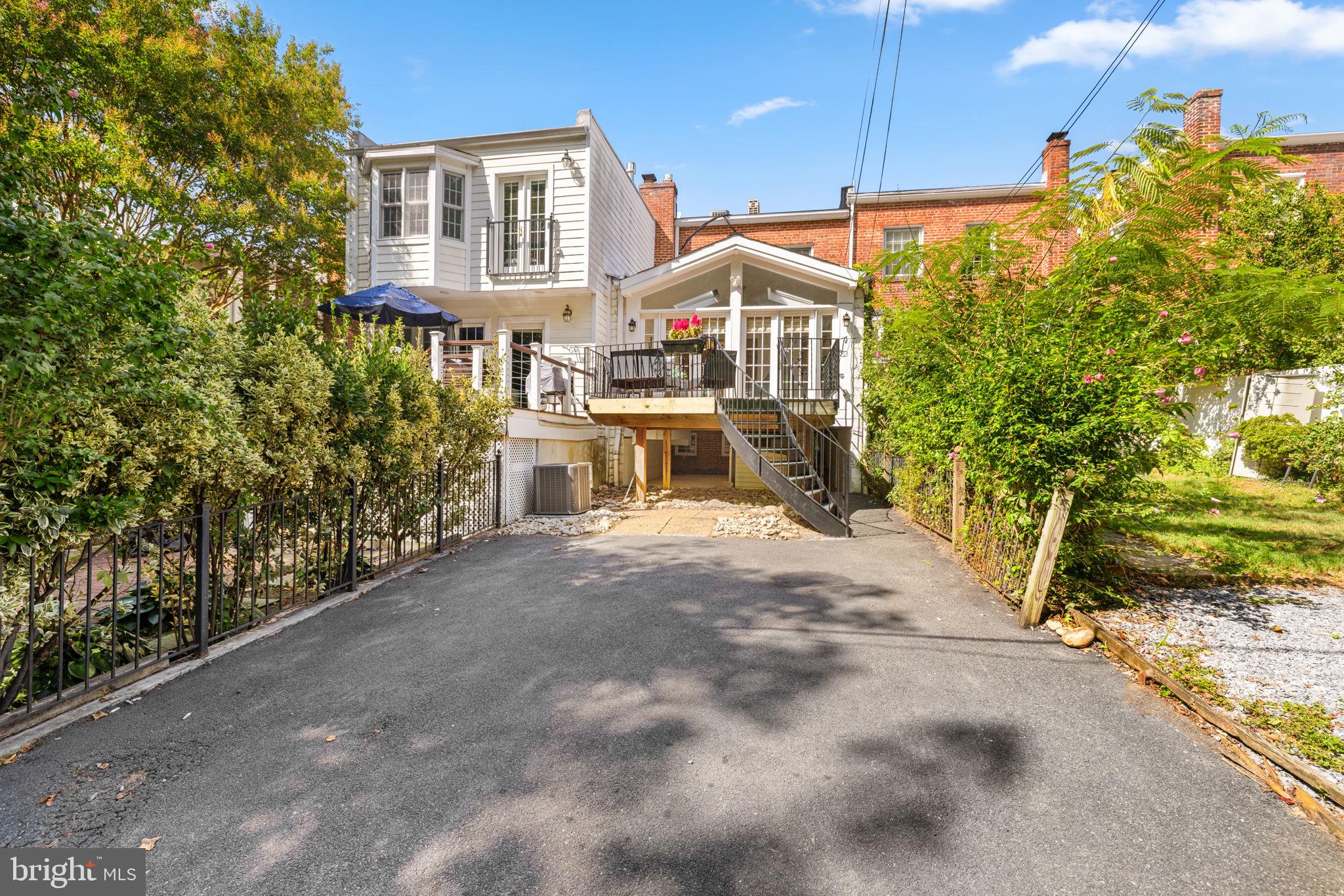 3762 W Street Northwest Washington, DC 20007 - Photo 37 of 41 a front view of a house with a yard