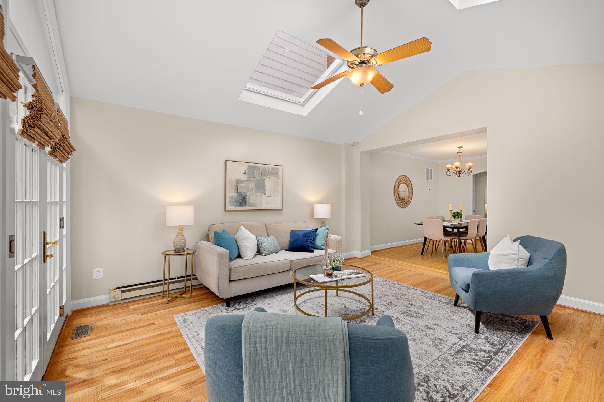 3762 W Street Northwest Washington, DC 20007 - Photo 7 of 41 a living room with furniture ceiling fan and a rug