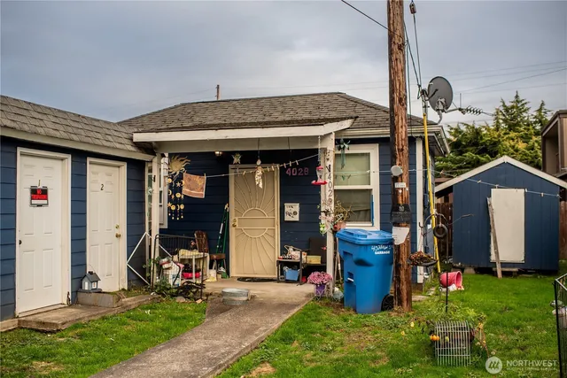 a front view of a house with a garden