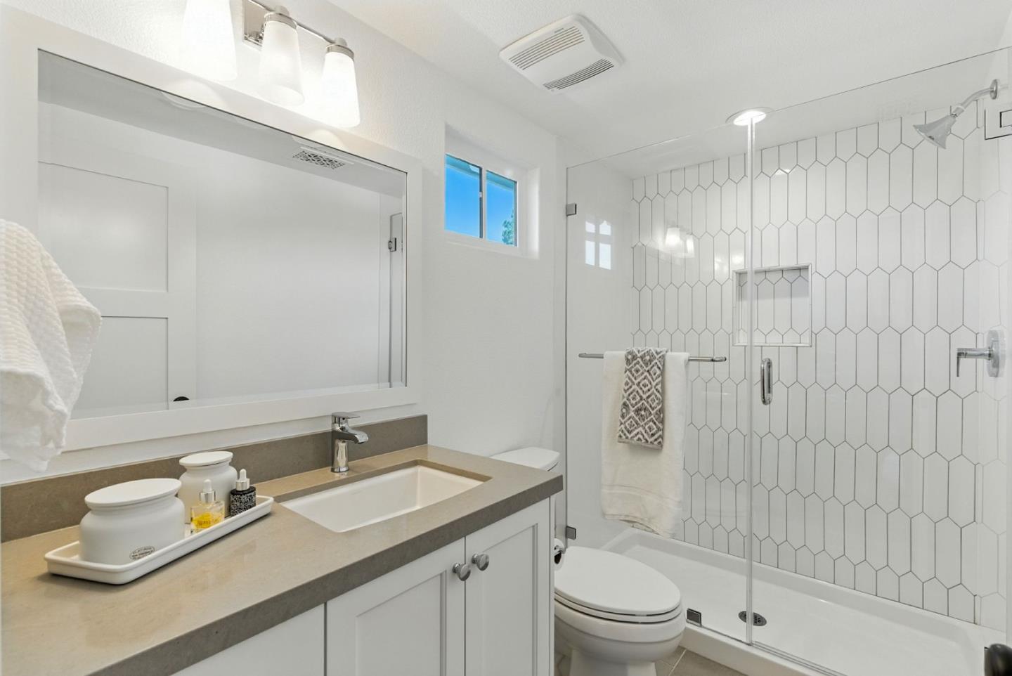 207 Oak Tree Circle Los Gatos, CA 95032 - Photo 10 of 16 a bathroom with a sink a toilet and shower