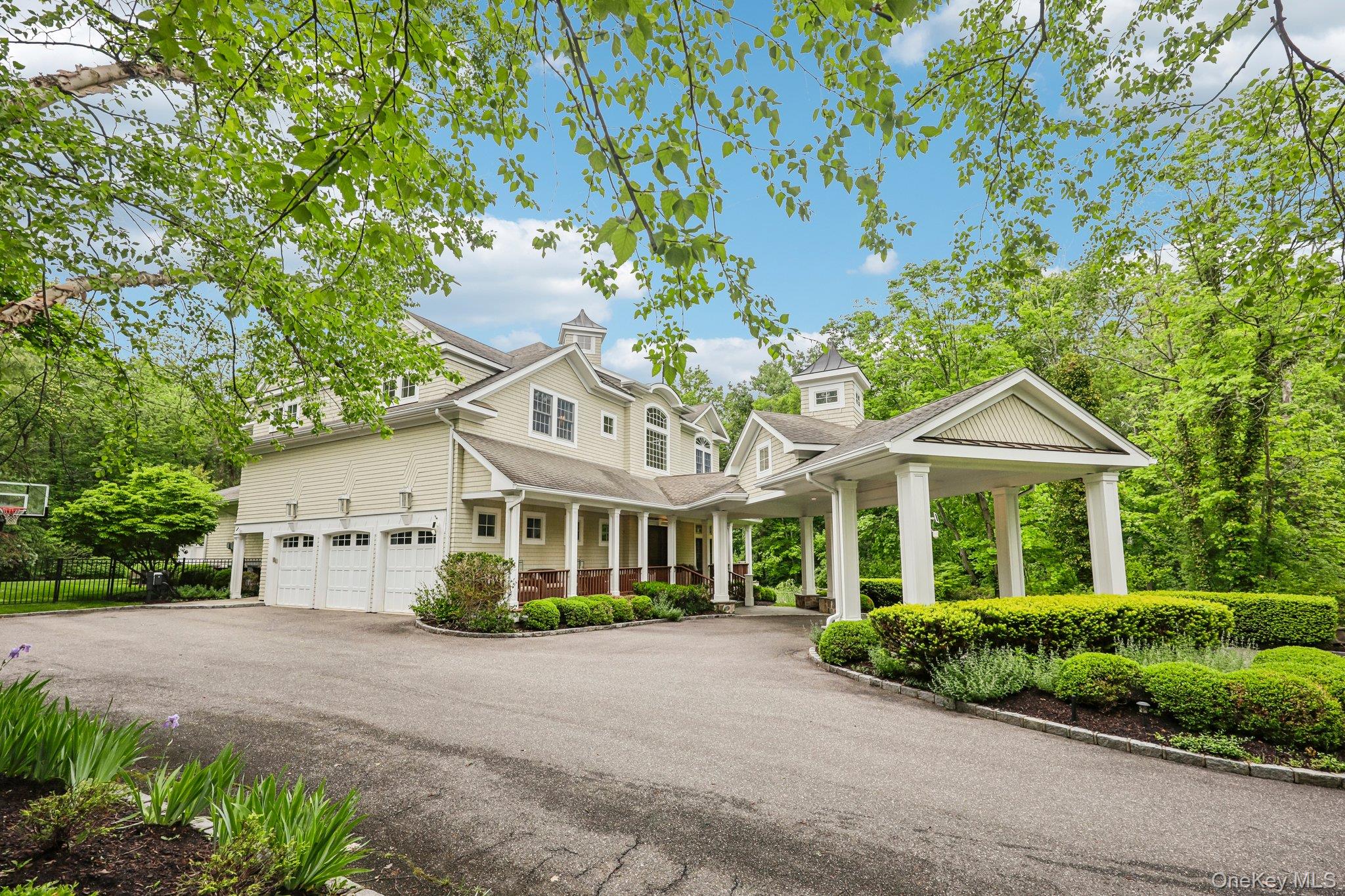 5 Mill Road Lloyd Harbor, NY 11743 - Photo 3 of 49 a view of a white house with a yard and potted plants