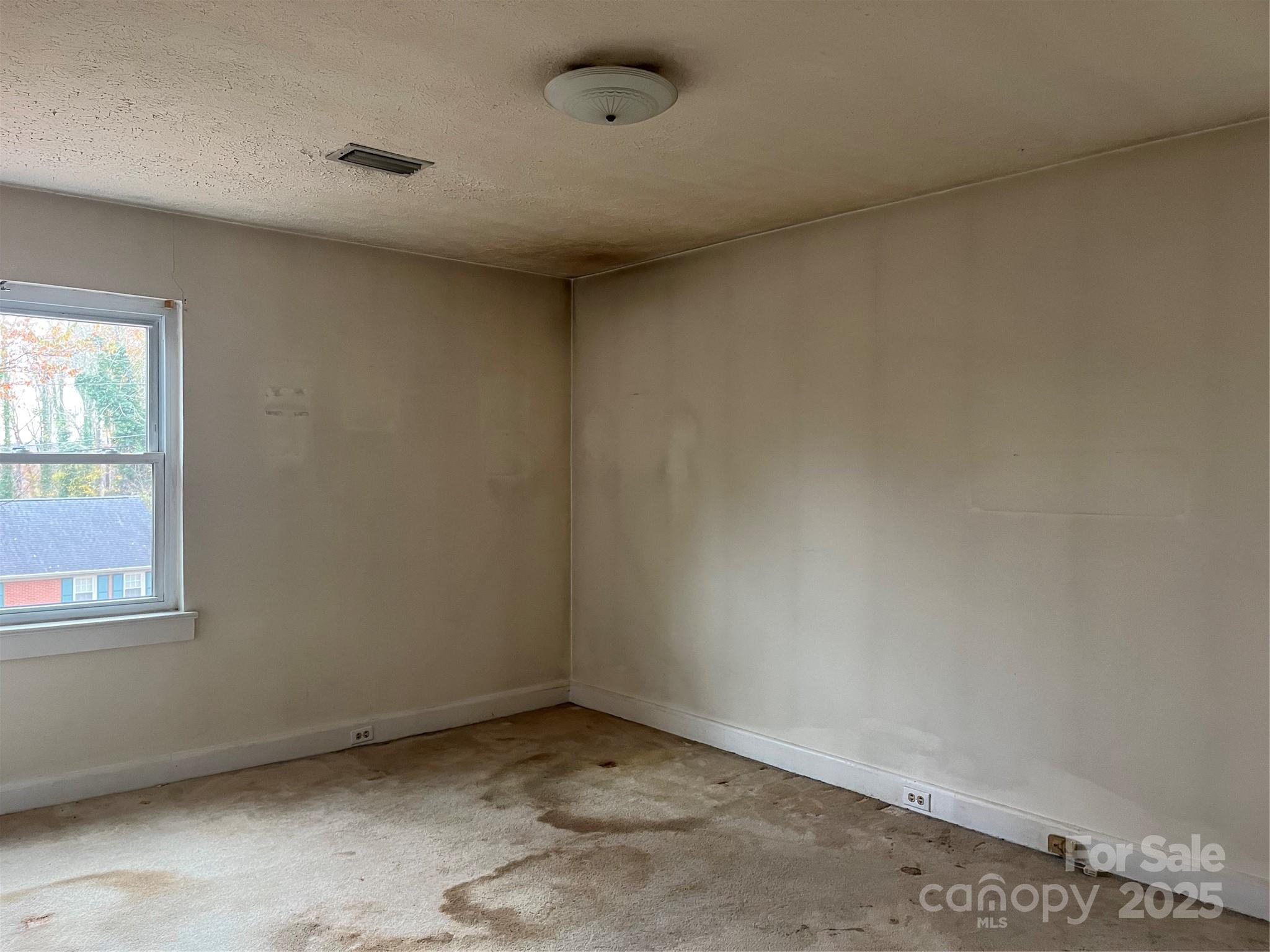 302 Walton Road Morganton, NC 28655 - Photo 11 of 21 an empty room with a window