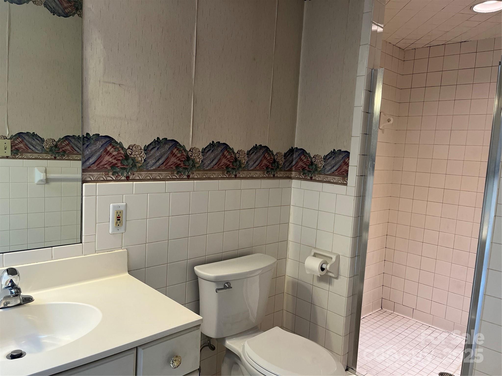 302 Walton Road Morganton, NC 28655 - Photo 13 of 21 a bathroom with a sink a toilet and shower