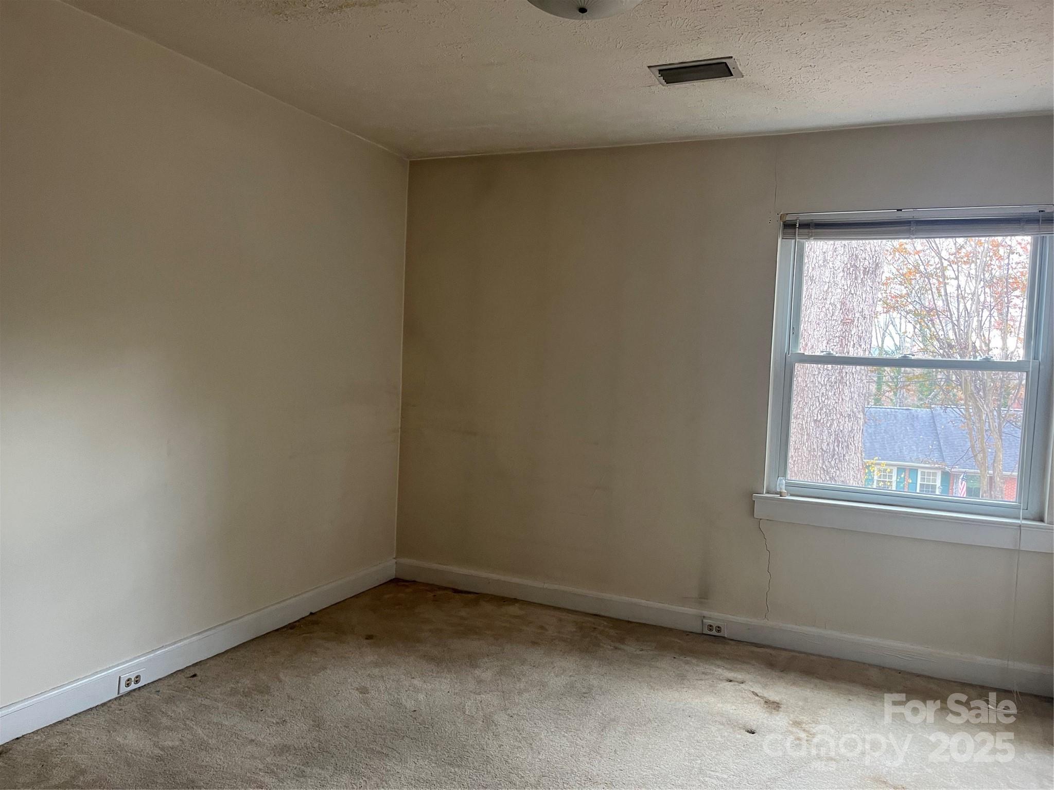 302 Walton Road Morganton, NC 28655 - Photo 9 of 21 an empty room with a window