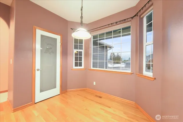 a view of empty room with windows