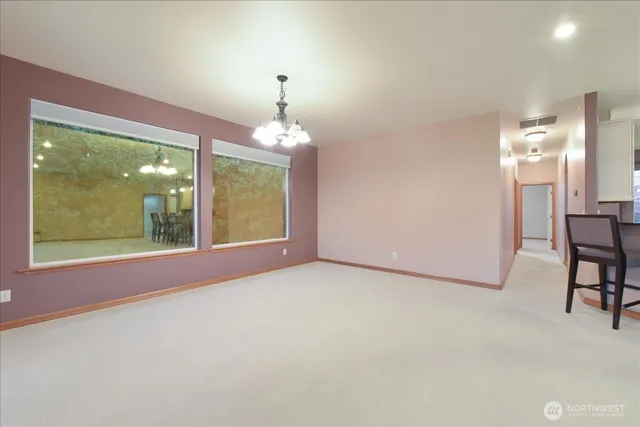 a view of livingroom with furniture and chandelier fan