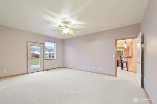 a view of an empty room with a window