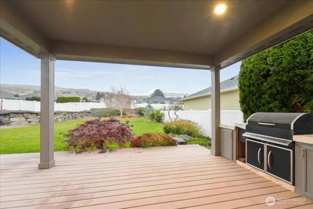 a view of a balcony with wooden floor