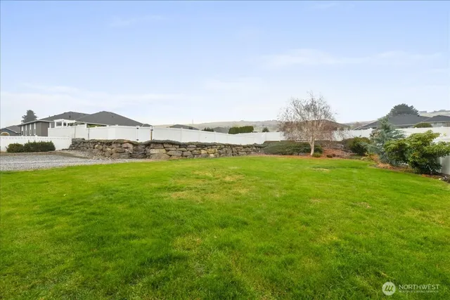 a view of a town with mountains in the background