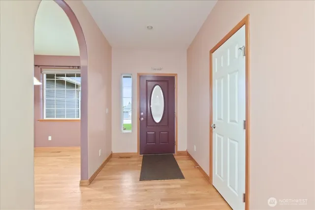 a view of a entryway door with wooden floor
