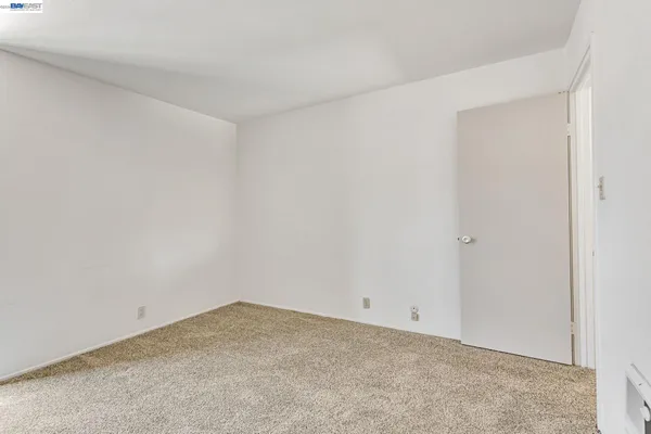 a bathroom with a sink a toilet a mirror and shower