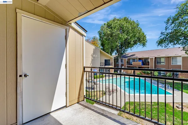 a view of a palm trees front of house