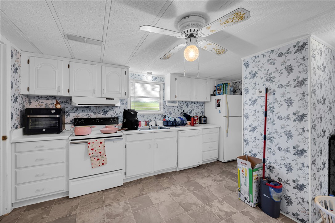 150 Newberry Road Walhalla, SC 29691 - Photo 11 of 47 A well-appointed kitchen offers ample cabinetry and essential appliances for everyday living.