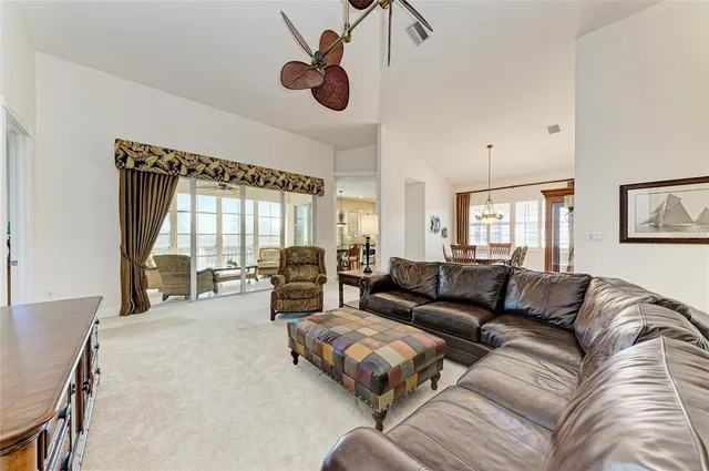 a dining room filled chandelier and a mirror