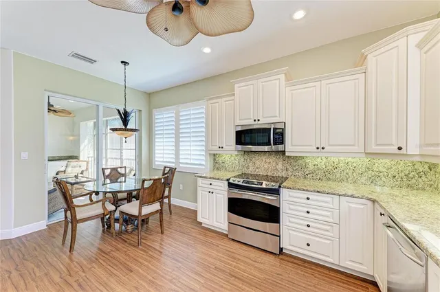 a bedroom with a bed dresser and a window