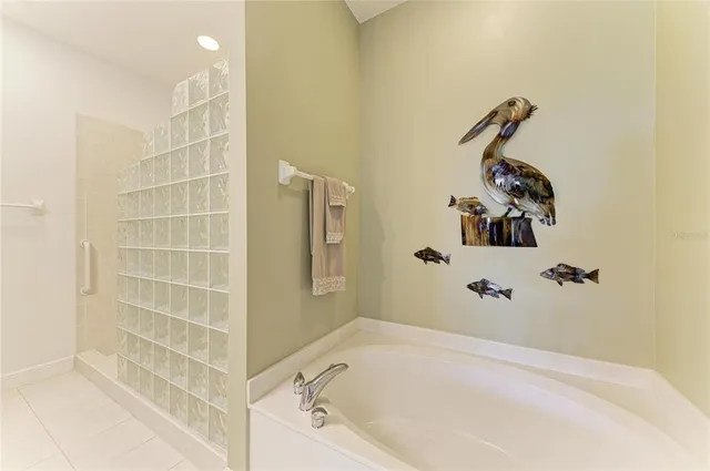 a bedroom with a bed dresser and a window