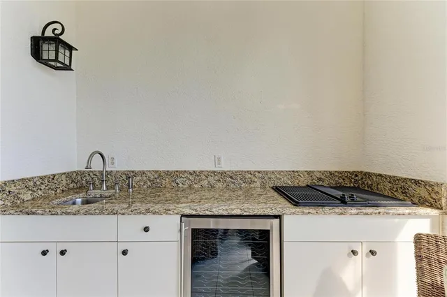 an aerial view of residential houses with outdoor space and swimming pool