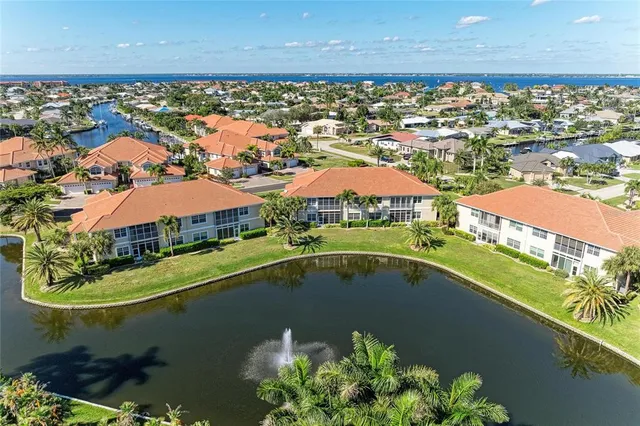 a swimming pool with outdoor seating and yard
