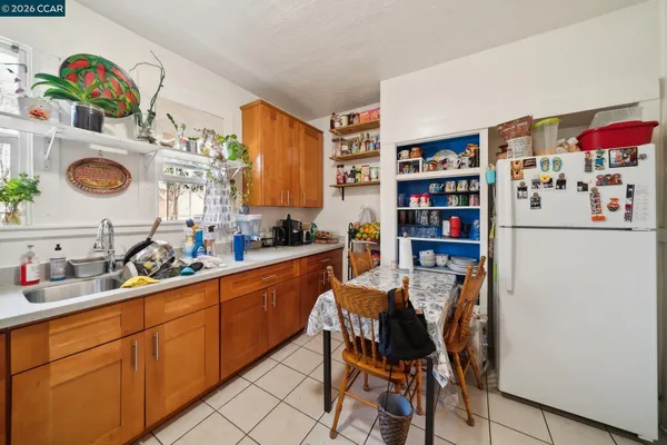 a kitchen with stainless steel appliances a refrigerator and a sink