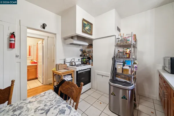 a view of a kitchen and an empty room
