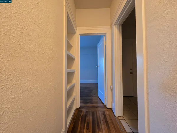 a bathroom with a sink vanity mirror and toilet