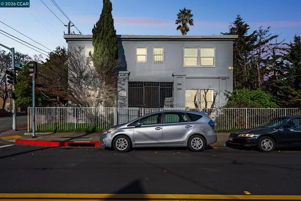 a front view of a house with parking space